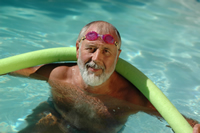 man swimming in pool